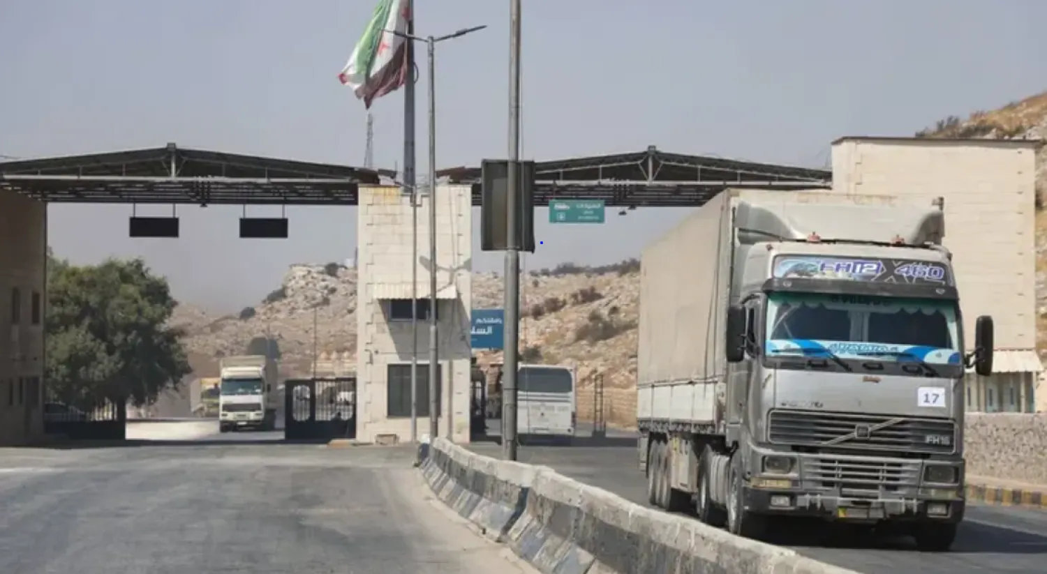 International humanitarian aid trucks cross into Syria’s northwestern Idlib province through the Bab al-Hawa border crossing with Turkey, on September 7, 2020. (AFP)
