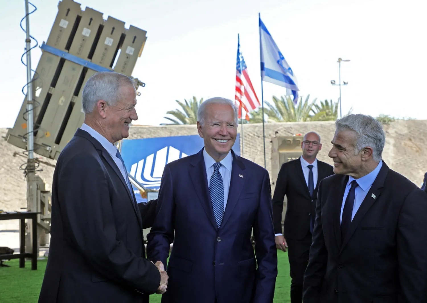 US President Joe Biden, Israeli caretaker Prime Minister Yair Lapid and Israeli Defense Minister Benny Gantz stand in front of Israel's Iron Dome defense system, during a tour at Ben Gurion Airport, in Lod, near Tel Aviv, Israel, July 13, 2022. (Reuters)