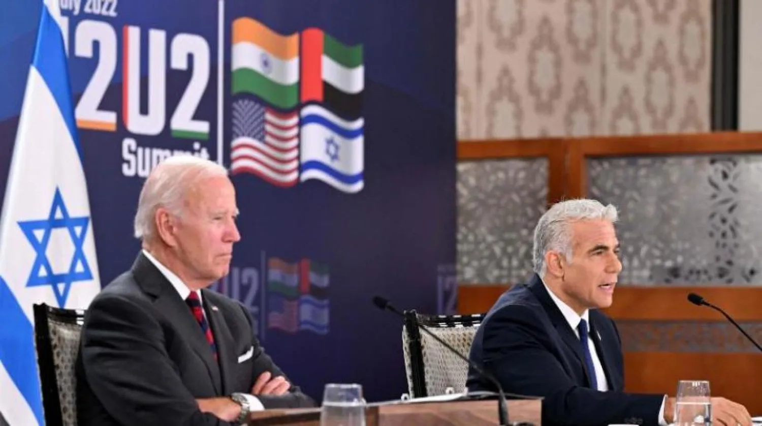 US President Joe Biden (L) and Israel's caretaker Prime Minister Yair Lapid, take part in a virtual meeting with leaders of the “I2U2” group, which includes, US, Israel, India, and the United Arab Emirates, at a hotel in Jerusalem, on July 14, 2022. (Photo by MANDEL NGAN / AFP)