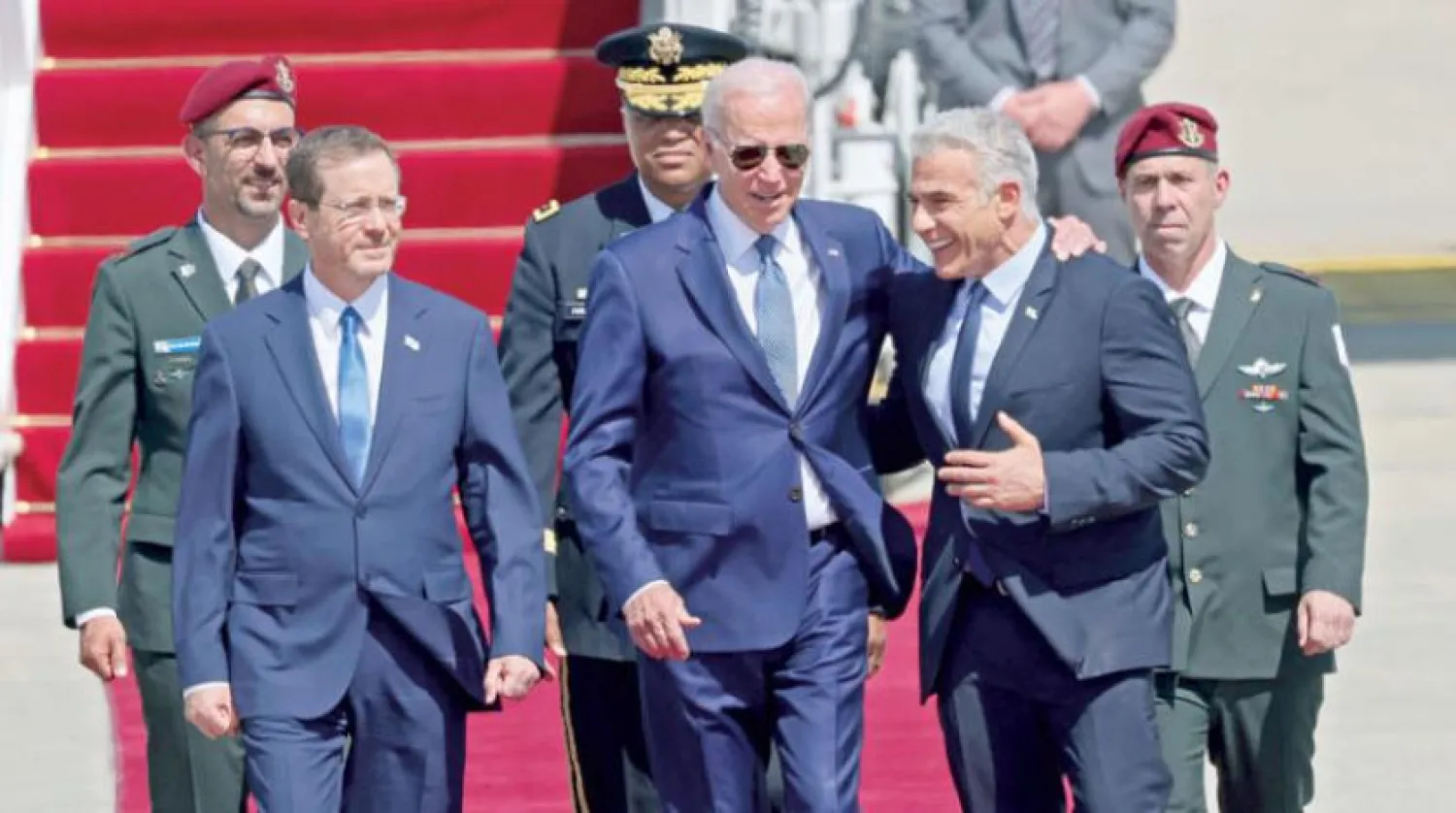  Biden welcomed by Lapid and Herzog at Ben Gurion Airport on Wednesday (AFP)