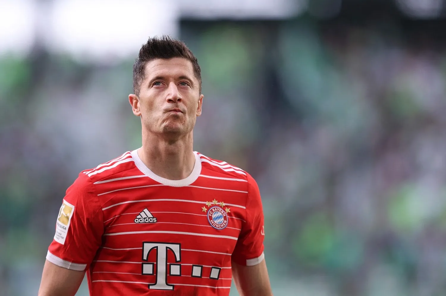 In this file photo taken on May 14, 2022 Bayern Munich's Polish forward Robert Lewandowski reacts after the German first division Bundesliga football match VfL Wolfsburg v Bayern Munich in Wolfsburg, northern Germany. (AFP)