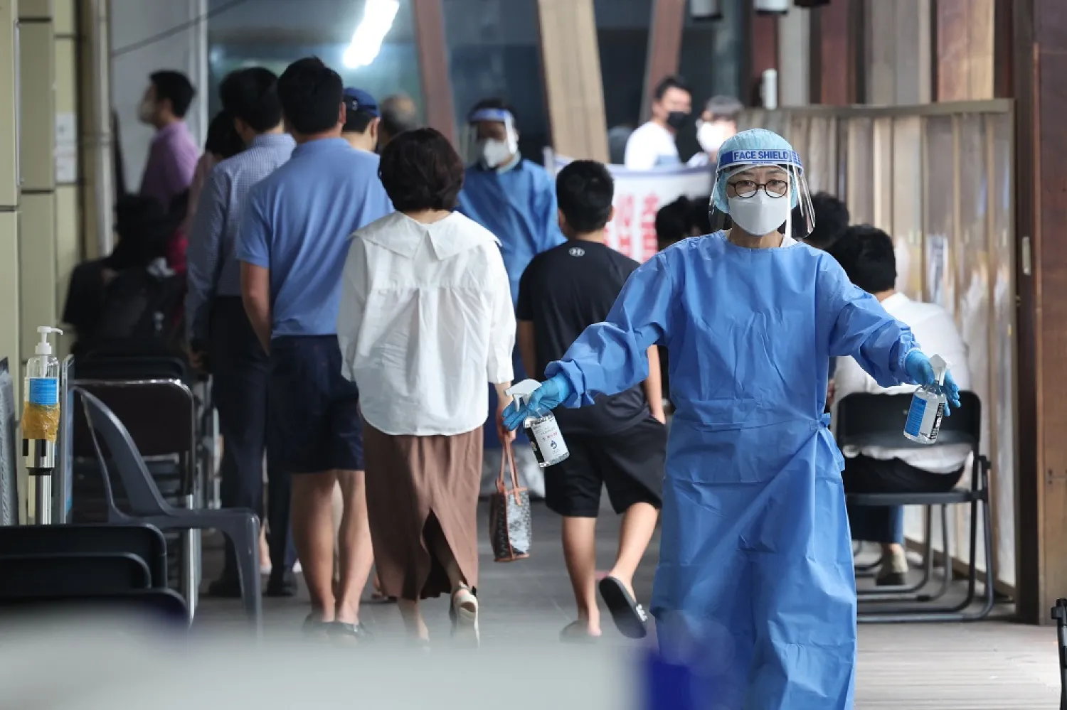 14 July 2022, South Korea, Seoul: A medical worker disinfects a screening clinic for coronavirus tests in Seoul's Songpa Ward. (dpa)