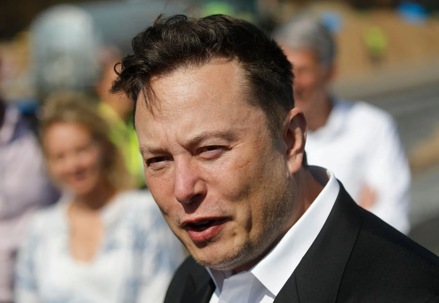 In this file photo taken on September 3, 2020 Tesla CEO Elon Musk talks to media as he arrives to visit the construction site of the future US electric car giant Tesla, in Gruenheide near Berlin. (AFP)
