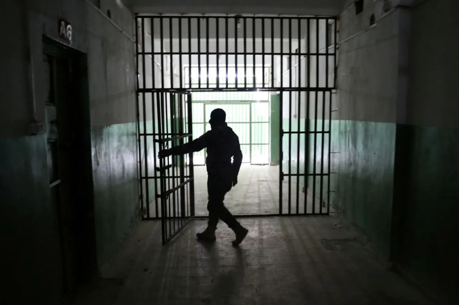 A guard opens a door inside a prison that holds foreign prisoners, suspected of being part of the ISIS, in Hasakah, Syria, January 7, 2020. REUTERS/Goran Tomasevic/File Photo

