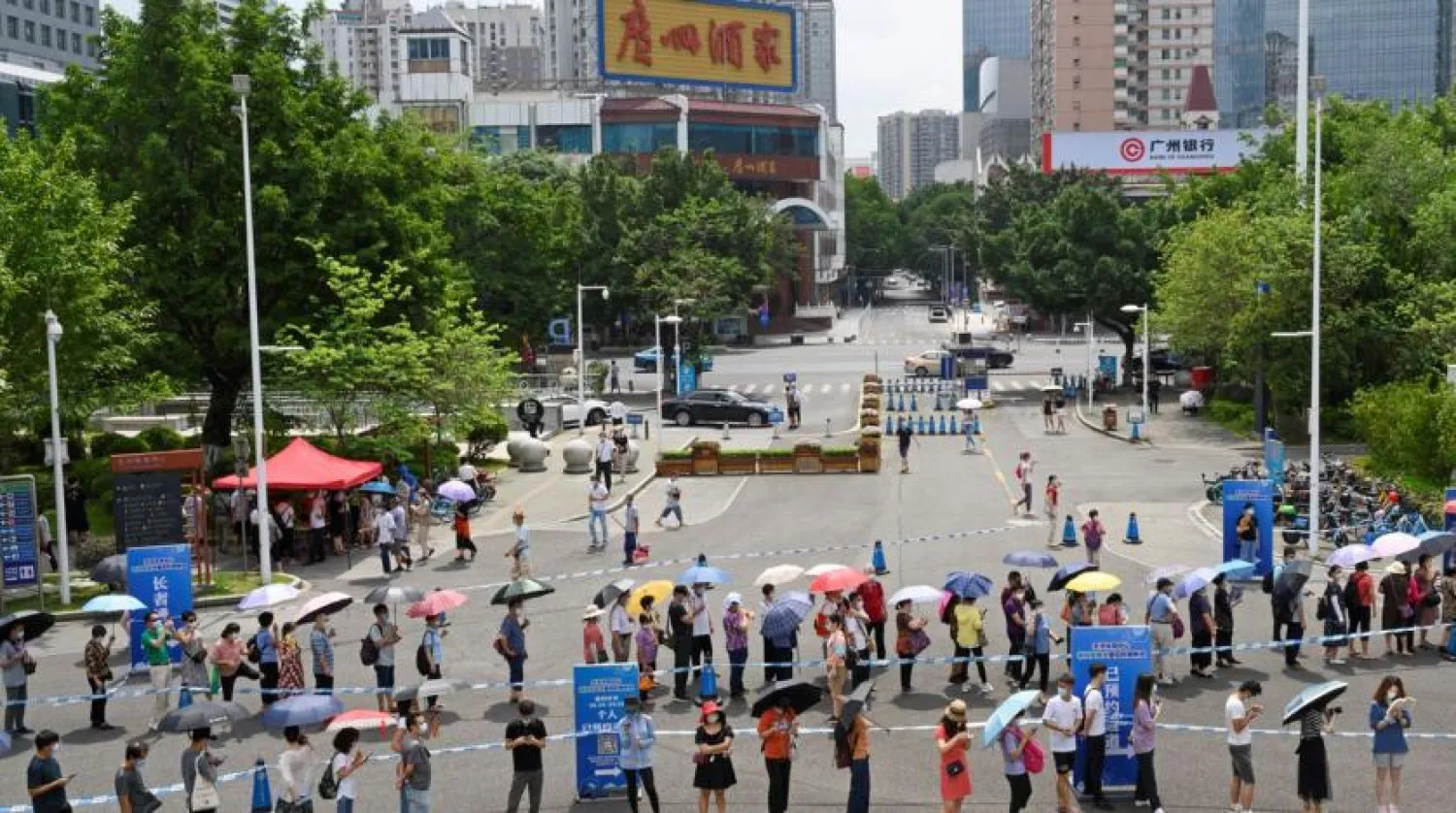People line up to receive the coronavirus vaccine in Guangzhou, China. Reuters file photo
