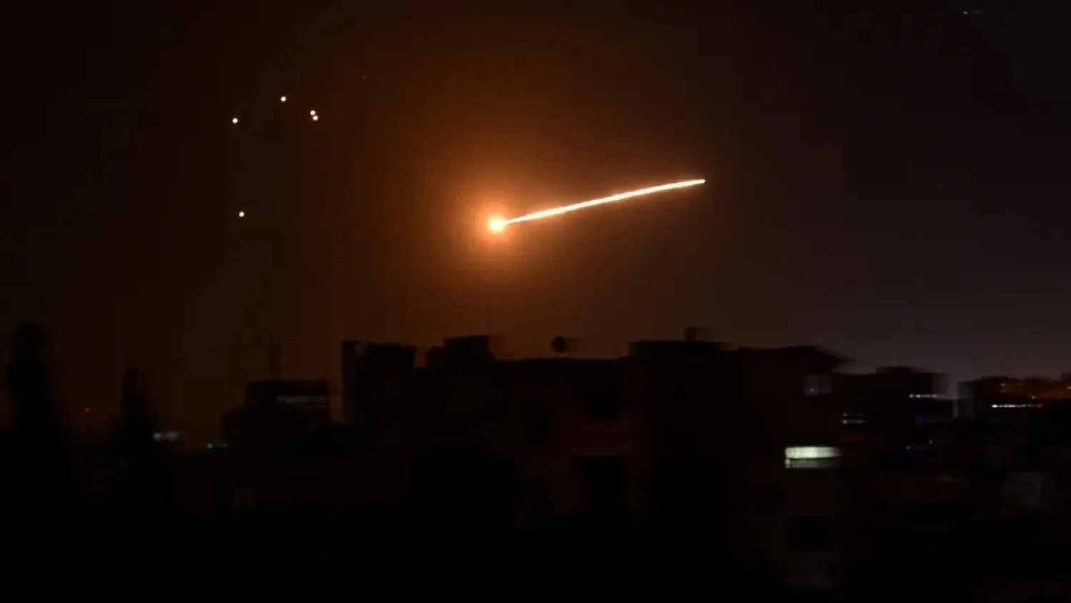 A handout picture released by the official Syrian Arab News Agency (SANA) on February 24, 2020, reportedly shows Syrian air defense intercepting an Israeli missile in the sky over the Syrian capital Damascus. (AFP)