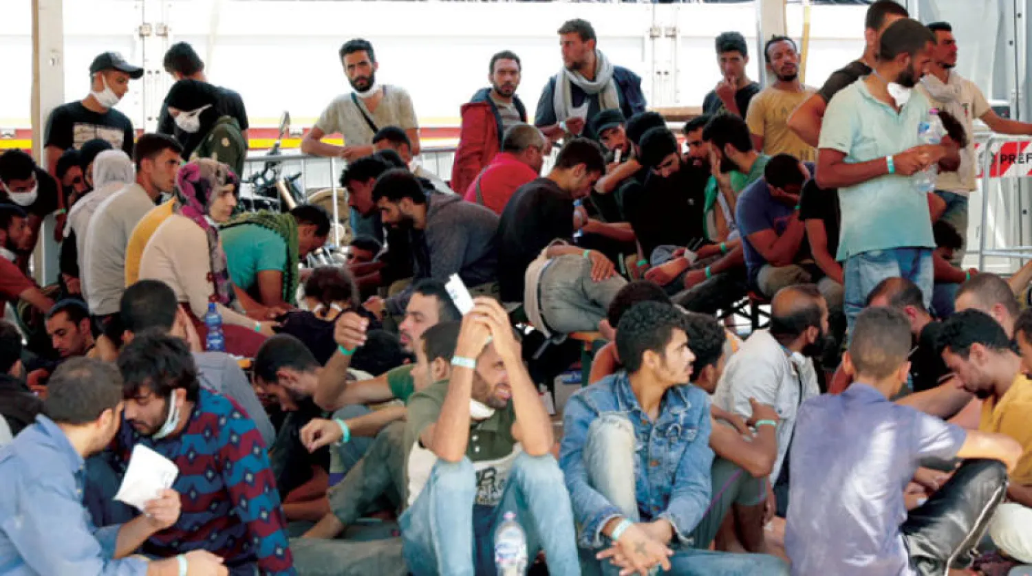 وصول مهاجرين إلى صقلية أمس (إ.ب.أ)