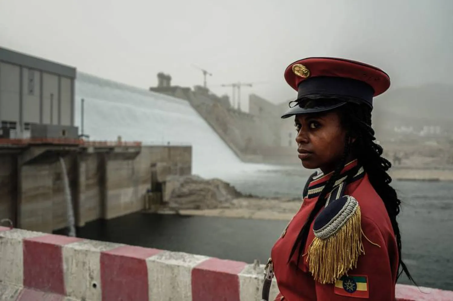 A member of the Republican March Band poses for photo before at the ceremony for the inaugural production of energy at the Grand Ethiopian Renaissance Dam. AFP 
