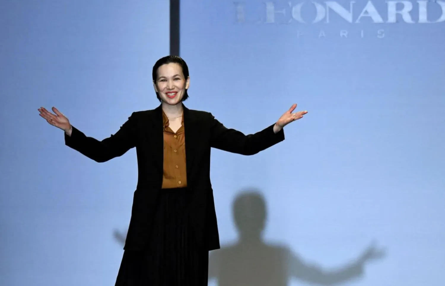 Designer Christine Phung appears at the end of her Fall/Winter 2020/21 women's ready-to-wear collection show for fashion house Leonard Paris during Paris Fashion Week in Paris, France, February 27, 2020. REUTERS/Piroschka van de Wouw/File Photo

