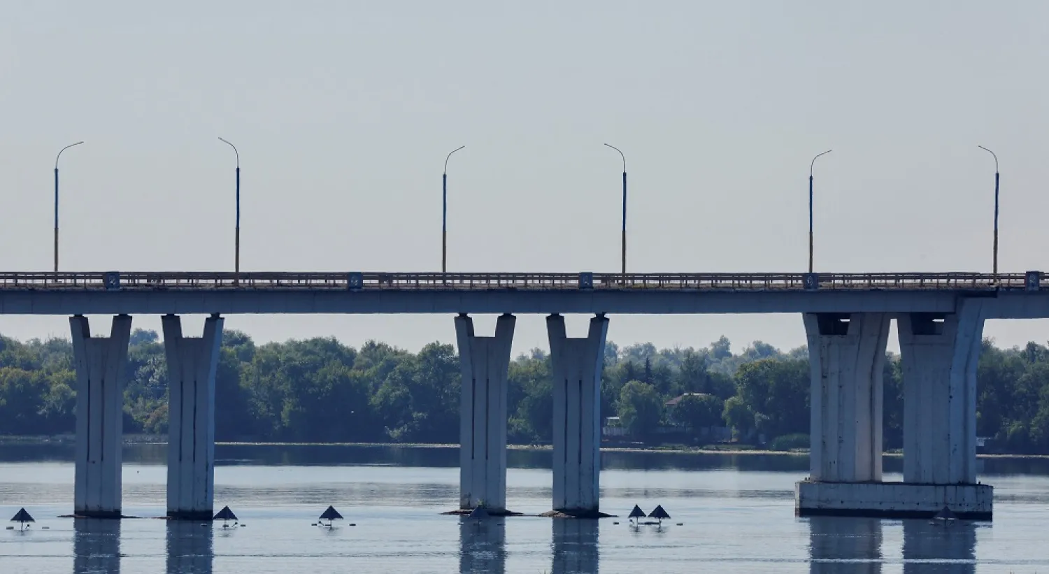 A general view shows the Antonivskyi (Antonovsky) bridge closed for civilians, after it reportedly came under fire during Ukraine-Russia conflict in the Russian-controlled city of Kherson, Ukraine July 27, 2022. (Reuters)