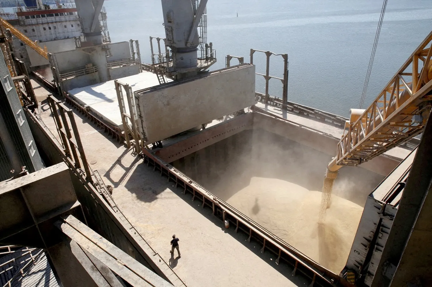 A dockyard worker watches as barley grain is mechanically poured into a 40,000 ton ship at a Ukrainian agricultural exporter's shipment terminal in the southern Ukrainian city of Nikolaev July 9, 2013. (Reuters)