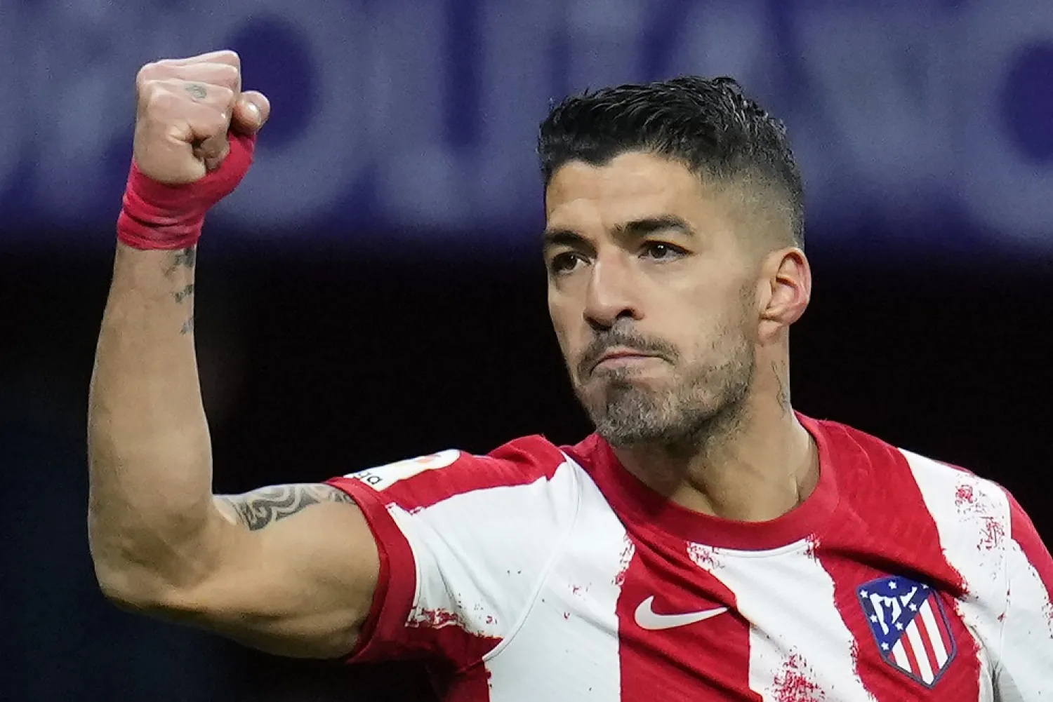 Atletico Madrid's Luis Suarez celebrates after scoring a penalty, his side's second goal, during a Spanish LaLiga match between Atletico Madrid and Alaves at the Wanda Metropolitano stadium in Madrid, Spain, Saturday, April 2, 2022. (AP)