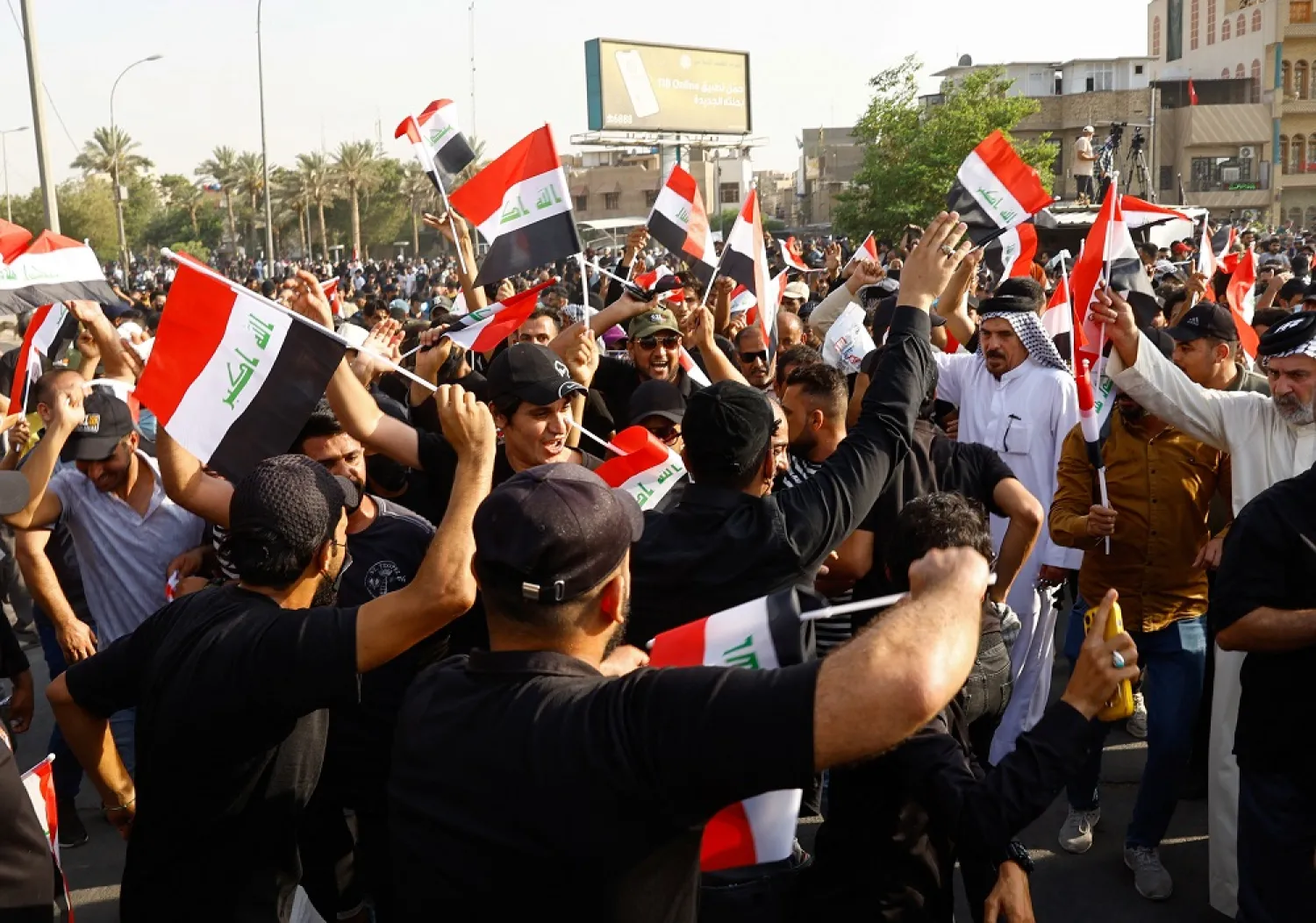 Supporters of the Coordination Framework, a grouping of Shiite parties, gather during a protest, amid a political crisis, near Green Zone, in Baghdad, Iraq August 1, 2022. (Reuters)
