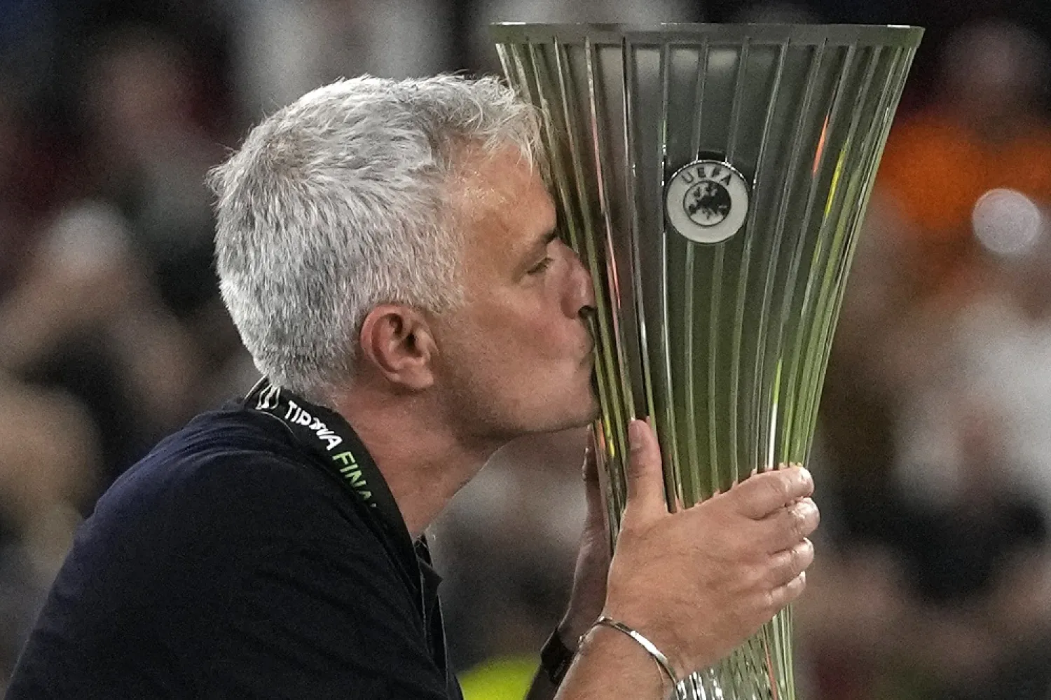 Roma's head coach Jose Mourinho kisses the Europa Conference League trophy at the end of the final match between AS Roma and Feyenoord at National Arena in Tirana, Albania, on May 25, 2022. (AP)