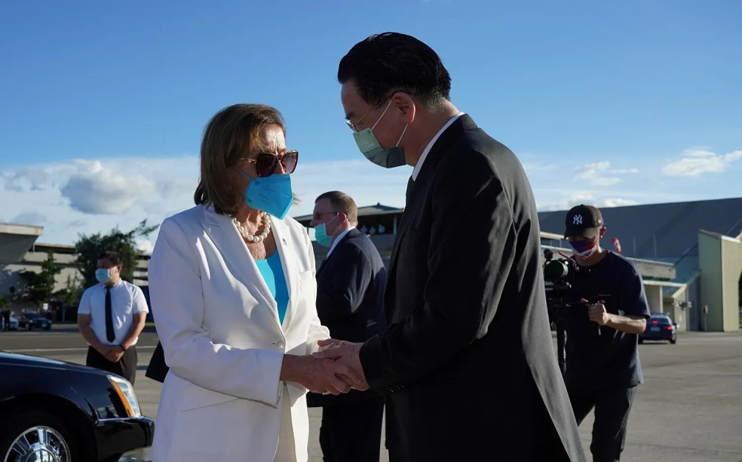 US House of Representatives Speaker Nancy Pelosi talks with Taiwan Foreign Minister Joseph Wu before boarding a plane at Taipei Songshan Airport in Taipei, Taiwan August 3, 2022. (Taiwan Ministry of Foreign Affairs/Handout via Reuters)