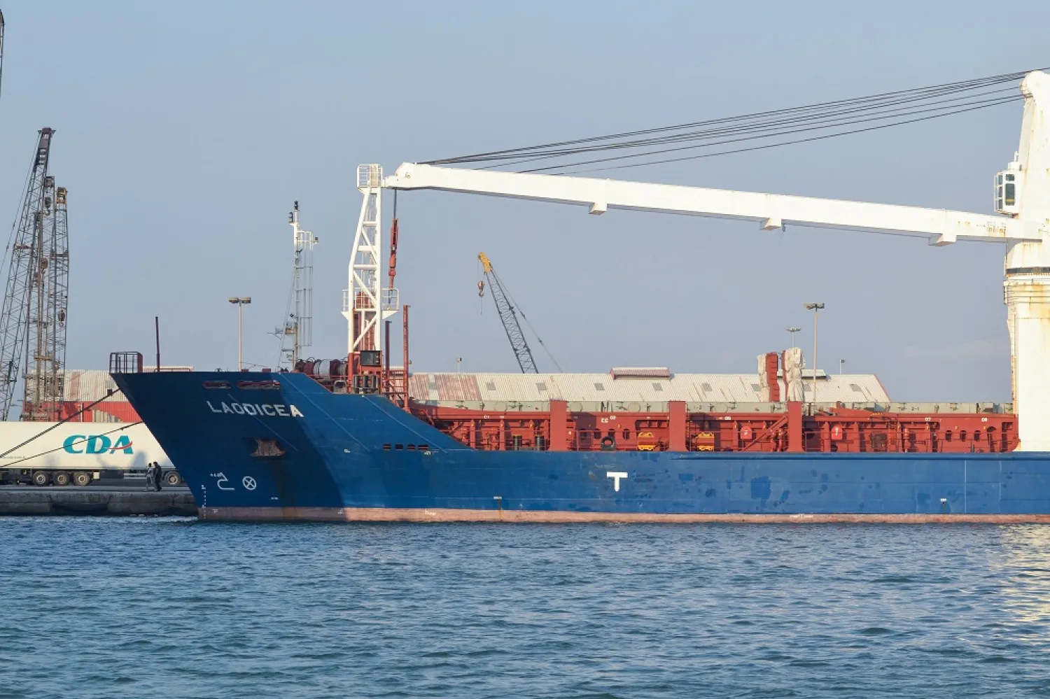 A picture shows a view of the bow of the grain-laden Syrian-flagged ship Laodicea, docked in Lebanon's northern port of Tripoli, on July 30, 2022. (AFP)