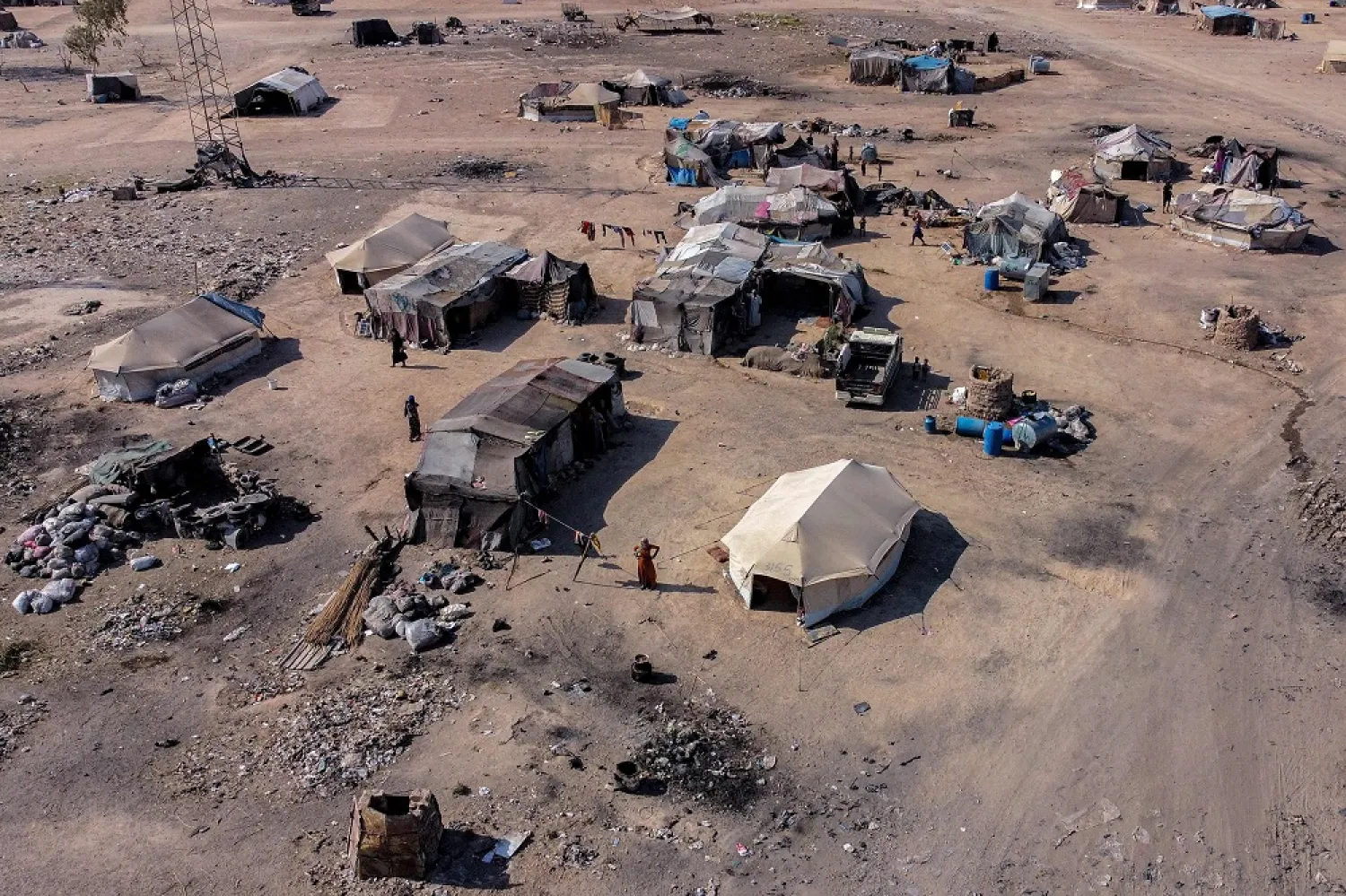 This picture taken on August 2, 2022 shows an aerial view of a camp for Syrians displaced by conflict near the Syrian northern city of Raqqa. (AFP)