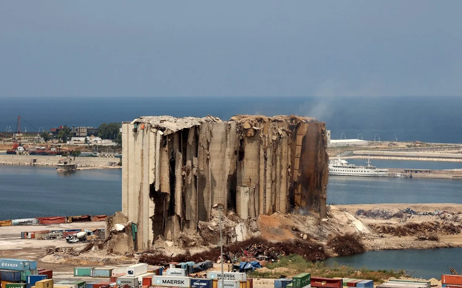 A picture shows the damaged grain silos at the port of the Lebanese capital Beirut, on August 2, 2022, following a partial collapse due to an ongoing fire since the beginning of the month. (AFP)