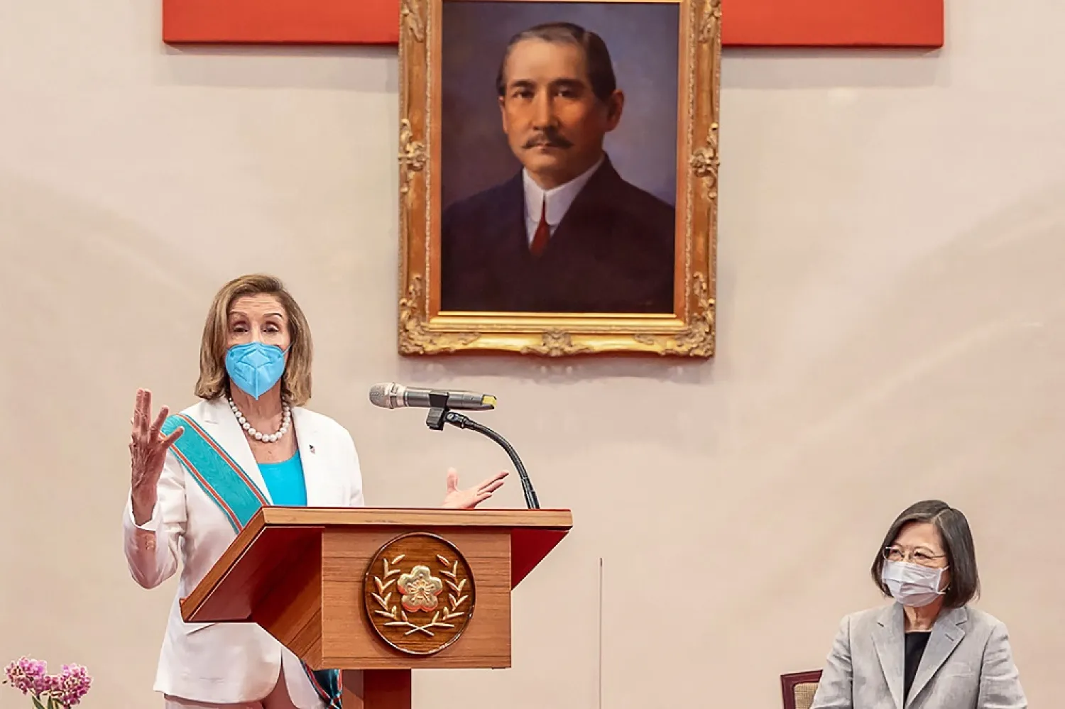 This handout taken and released by Taiwan's Presidential Office on August 3, 2022 shows US House Speaker Nancy Pelosi speaking, as Taiwan's President Tsai Ing-wen listens, in the Presidential Office in Taipei. (Handout / Taiwan Presidential Office / AFP) /