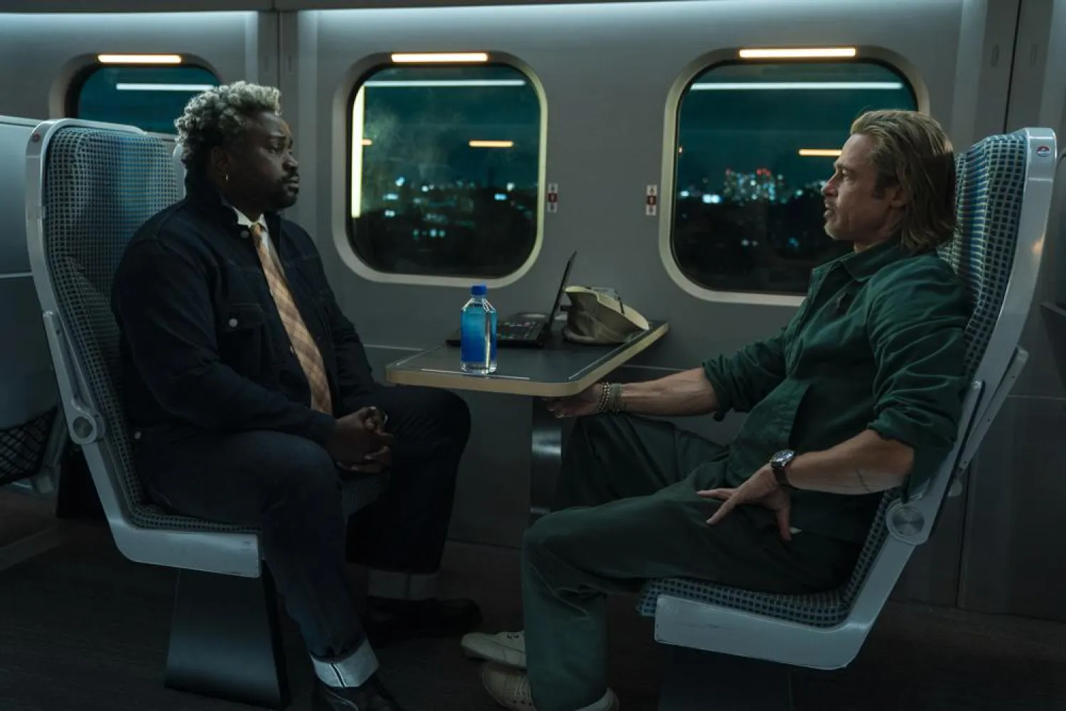 This image released by Sony Pictures shows Bryan Tyree Henry, left, and Brad Pitt in a scene from "Bullet Train." (Sony Pictures via AP)