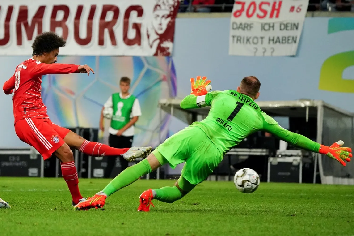 Bayern's Leroy Sane (L) scores the 5-3 lead during the DFL Supercup 2022 match between RB Leipzig and FC Bayern Munich in Leipzig, Germany, 30 July 2022. (EPA)