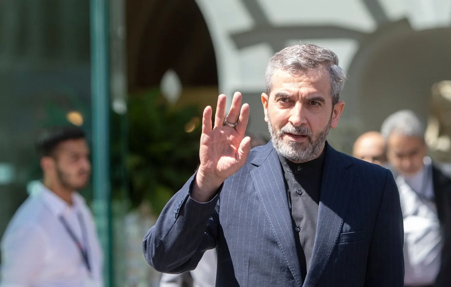 Iran's chief nuclear negotiator Ali Bagheri Kani waves as he leaves after talks at the Coburg Palais, the venue of the Joint Comprehensive Plan of Action (JCPOA) in Vienna on August 4, 2022. (AFP)