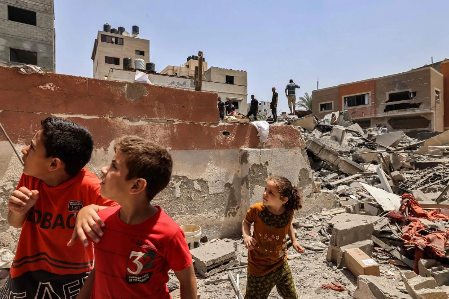Children react following an Israeli air strike in Gaza City on August 6, 2022. (AFP)