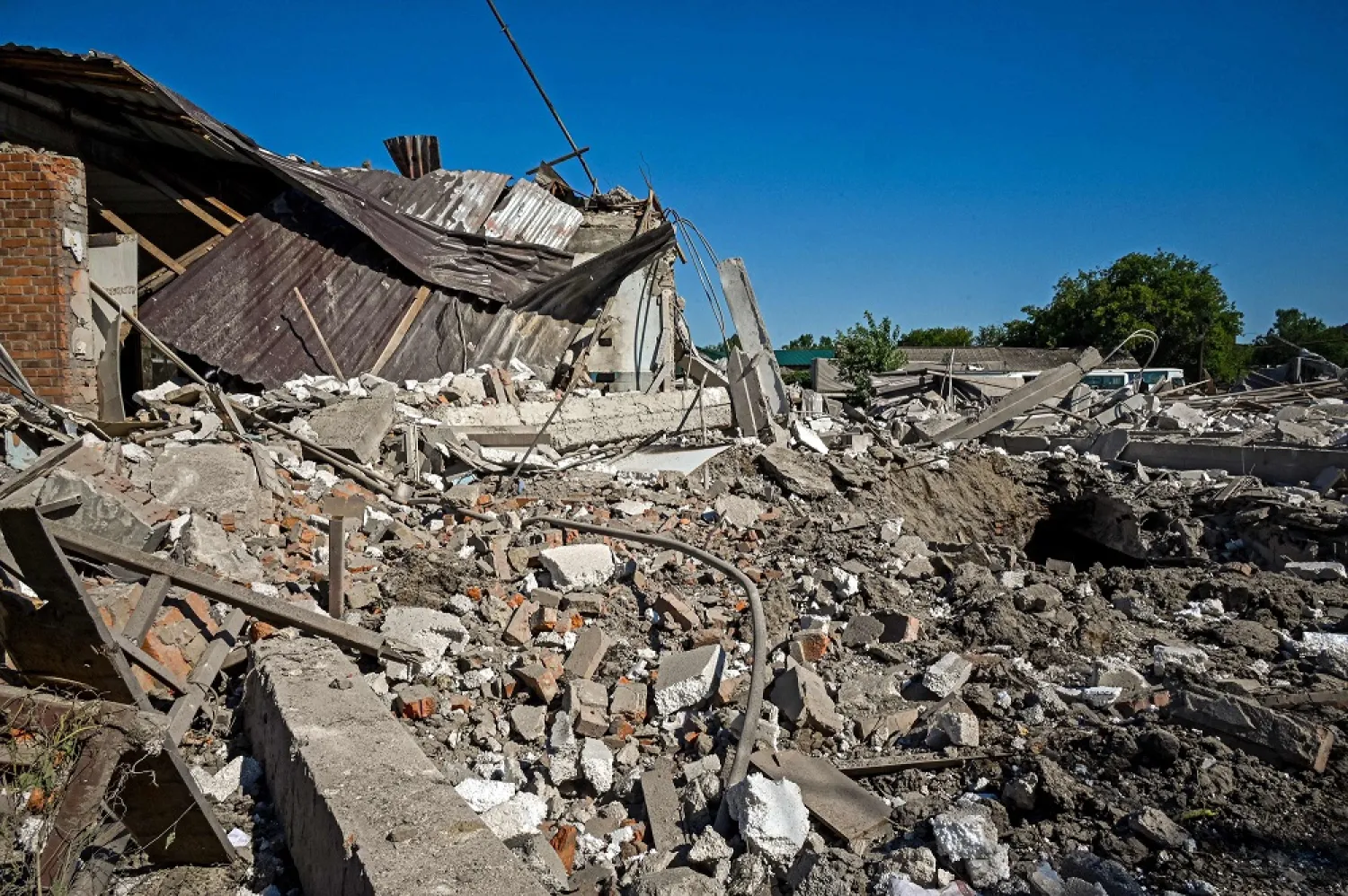 This picture taken on August 6, 2022 shows ruins of a furniture factory following a missile strike on the second largest Ukrainian city of Kharkiv on August 6, 2022, as the Russia-Ukraine war enters its 163rd day. (AFP)