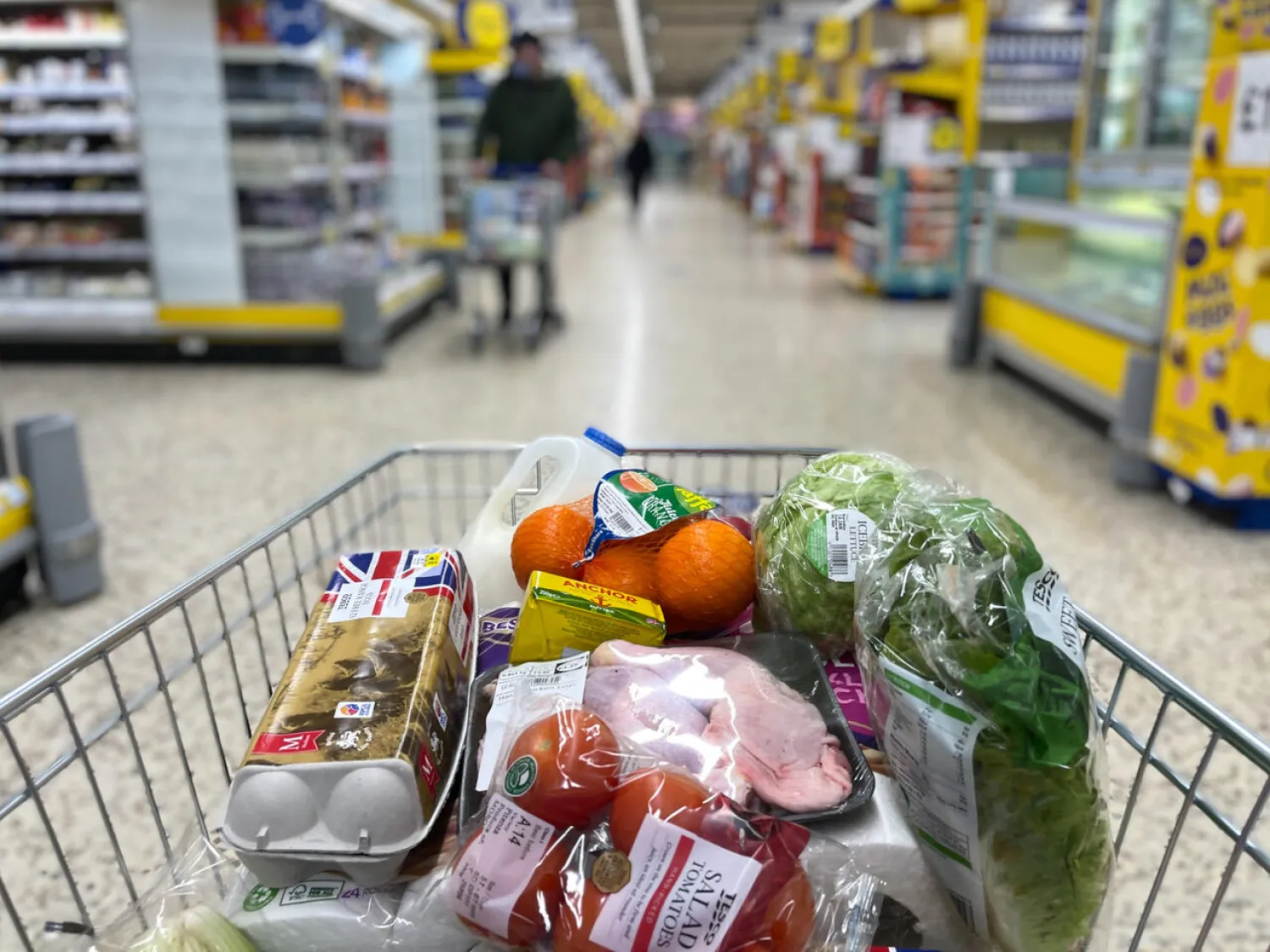 A shopper fills their basket in a Tesco supermarket: scientists have studied the environmental impact of 57,000 products sold in supermarkets in Britain and Ireland Daniel LEAL AFP/File
