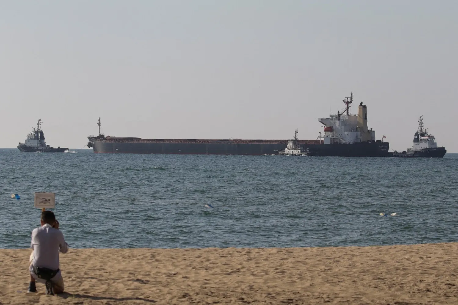 A Liberian-flagged bulk carrier Ocean Lion leaves the sea port in Chornomorsk after restarting grain export, amid Russia's attack on Ukraine, Ukraine August 9, 2022. (Reuters)