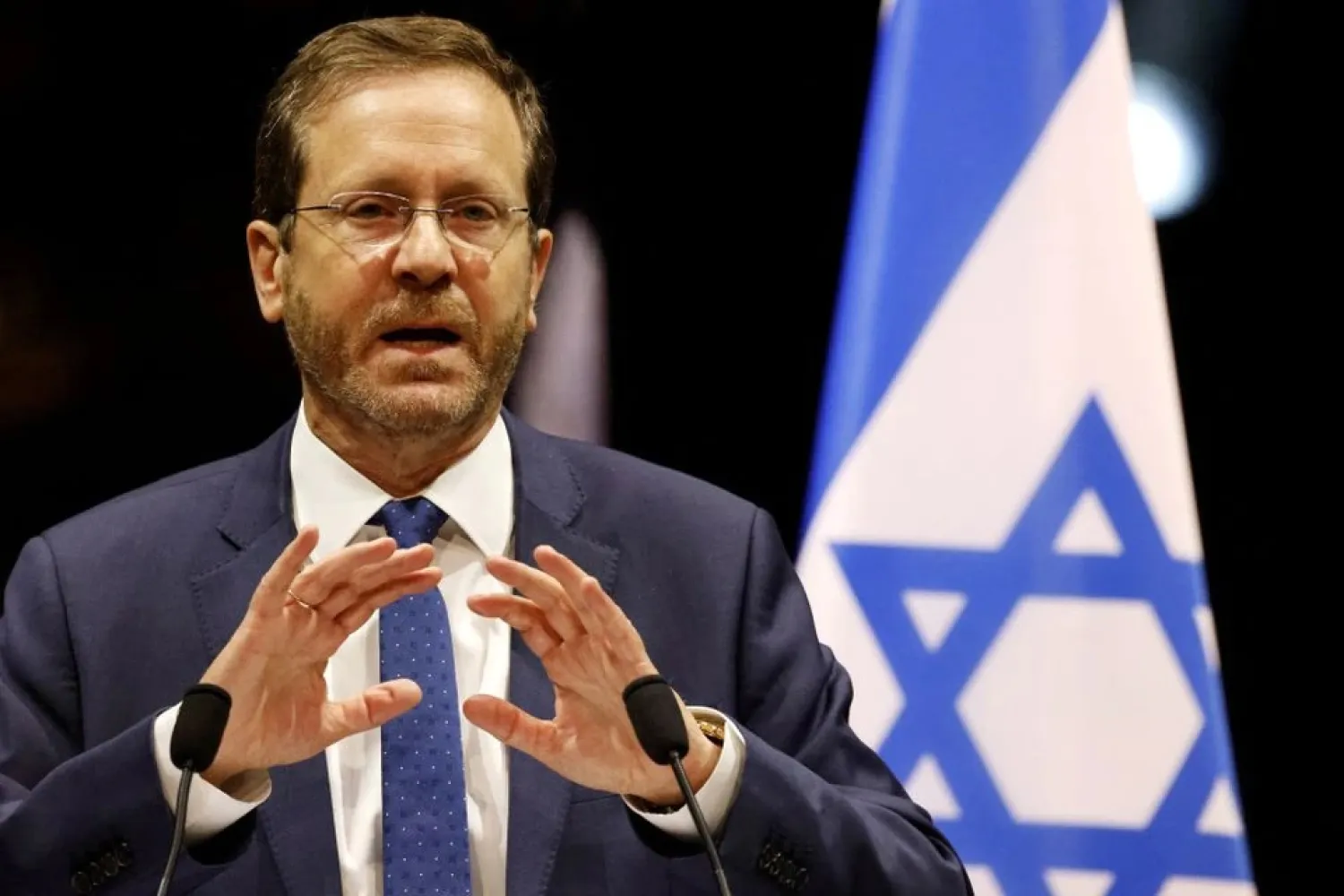 Israel's President Isaac Herzog delivers a speech during a tribute ceremony at the Halle aux Grains in Toulouse, southern France, on March 20, 2022. (Reuters)