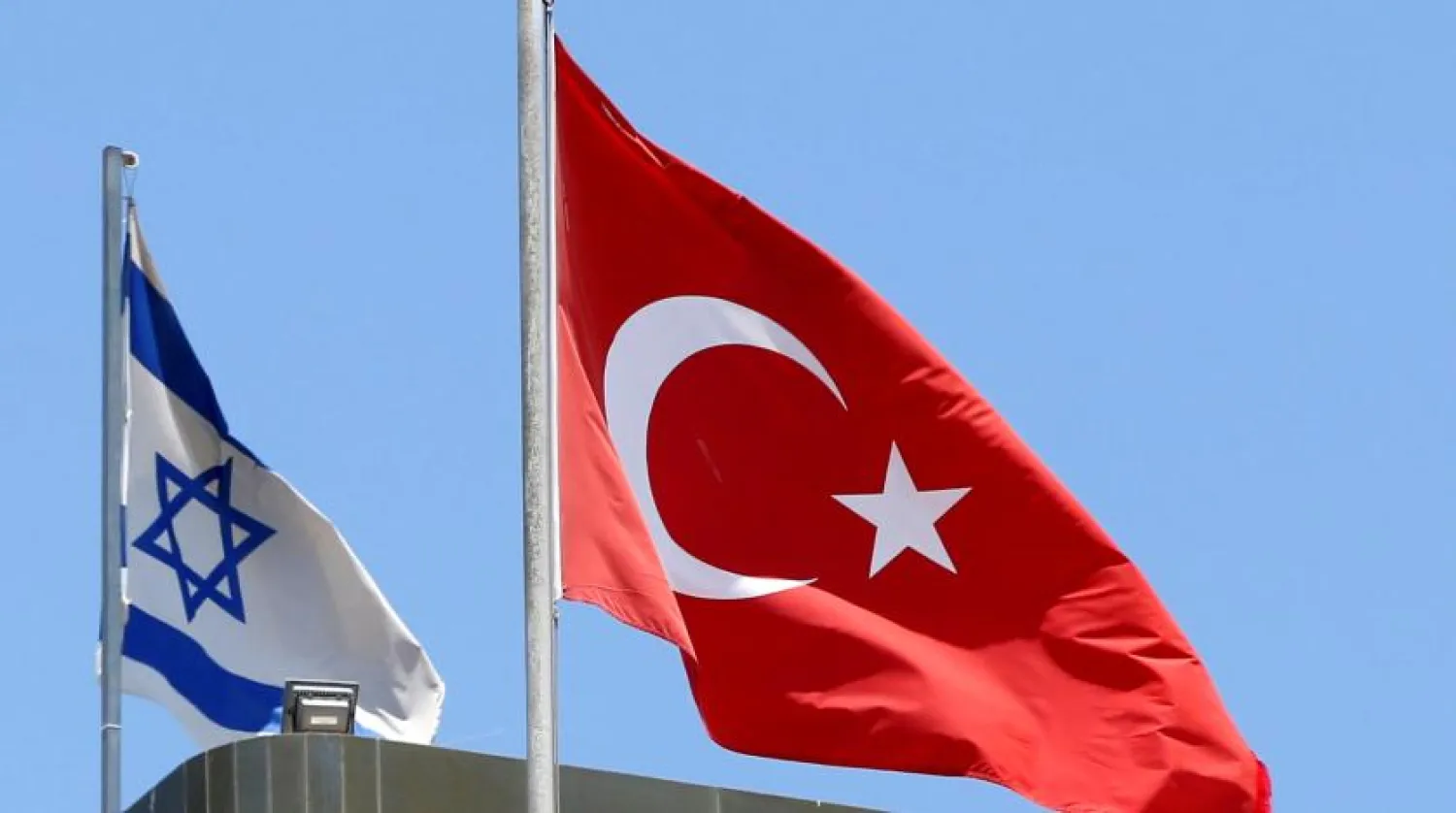 A Turkish flag flutters atop the Turkish embassy as an Israeli flag is seen nearby, in Tel Aviv, Israel June 26, 2016. REUTERS/Baz Ratner/File Photo
