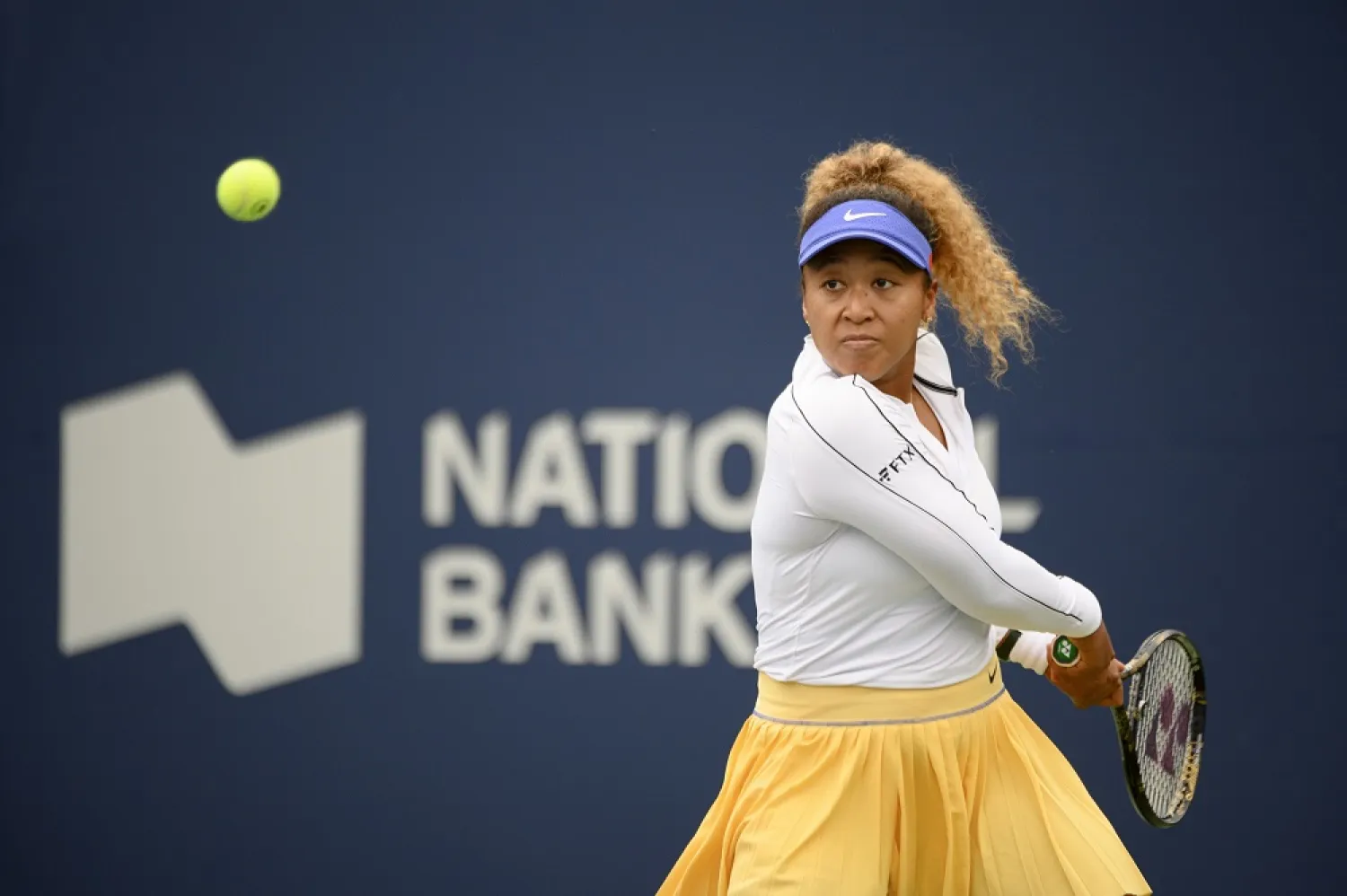 09 August 2022, Canada, Toronto: Japanese tennis player Naomi Osaka in action against Estonia's Kaia Kanepi during their women's singles round of 64 tennis match of the Canadian open. (dpa)