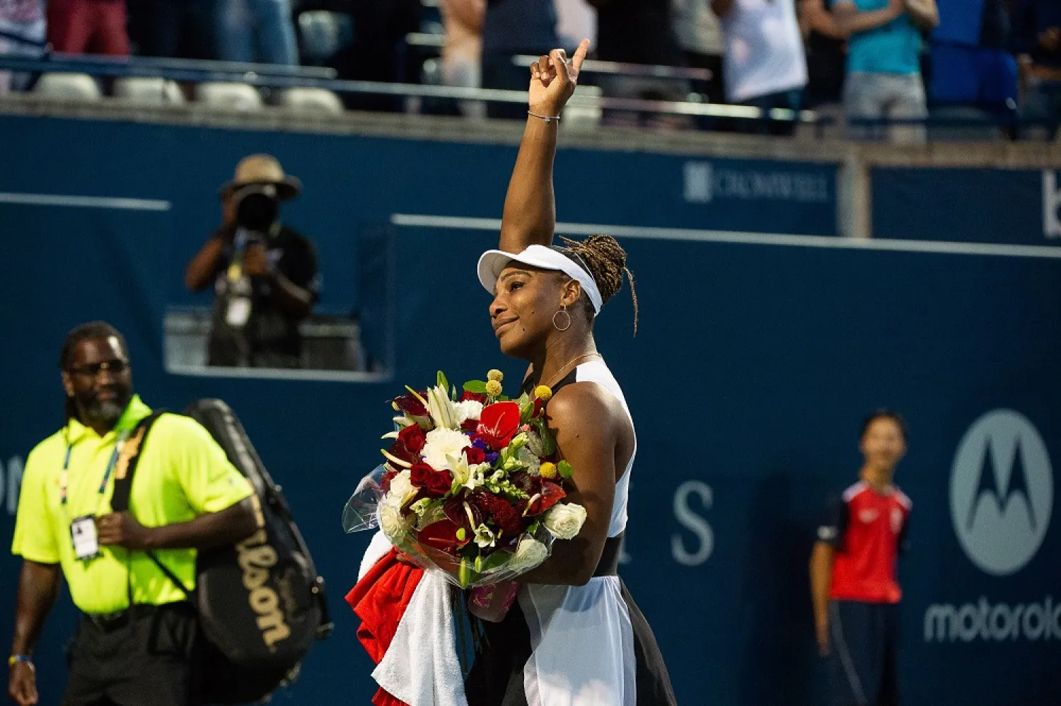 Serena Williams of the US acknowledges the crowd after her match against Belinda Bencic of Switzerland, during the second round of the National Bank Open women's tennis tournament, in Toronto, Canada, 10 August 2022. (EPA)