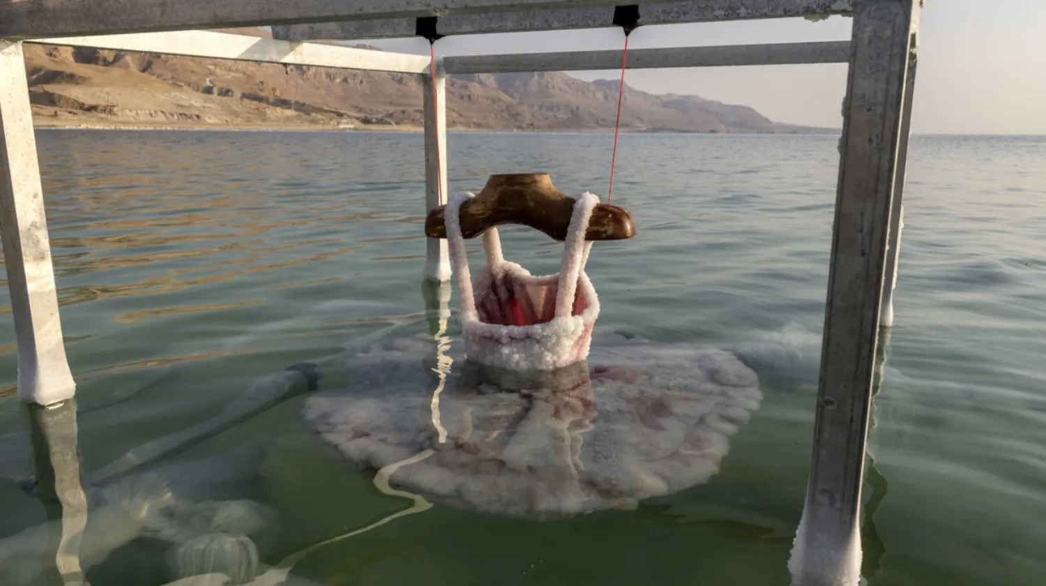 A ballerina dress is submerged in the Dead Sea and encrusted with salt, a project by Israeli artist Sigalit Landau MENAHEM KAHANA AFP
