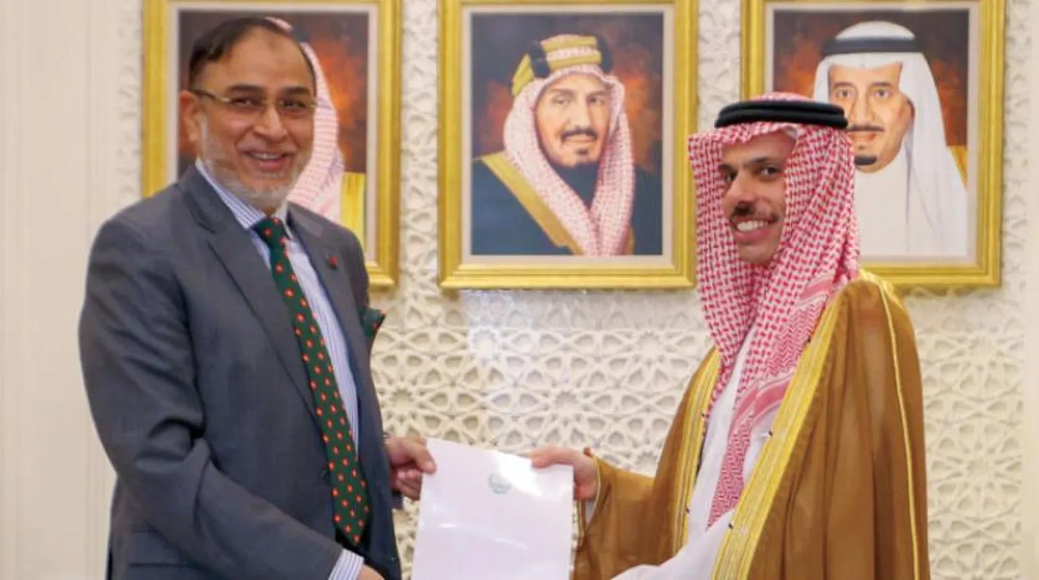 Saudi Foreign Minister Prince Faisal bin Farhan bin Abdullah receives the message from Ambassador Mohammed Javed Patwary. (SPA)