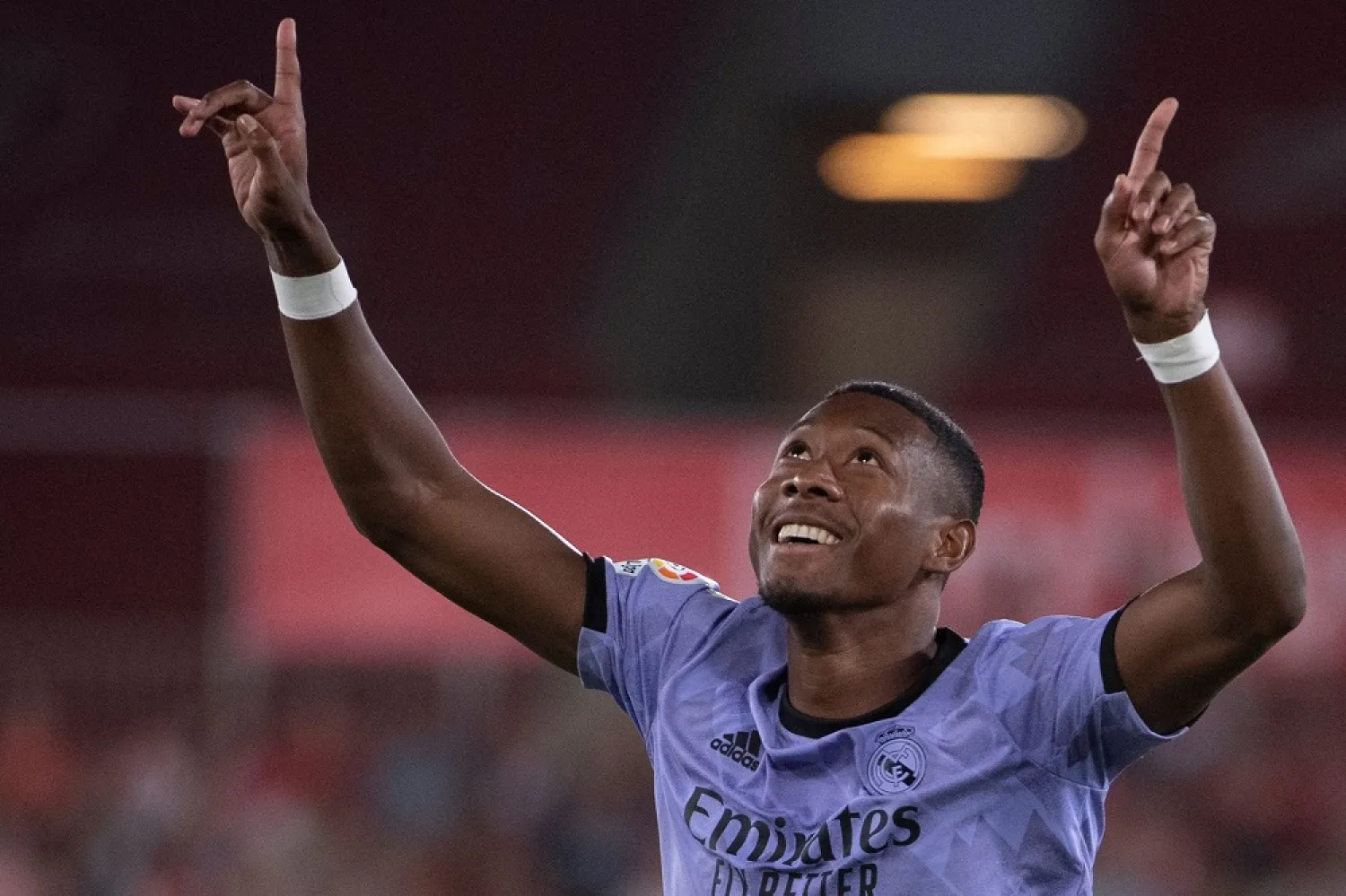 Real Madrid's Austrian defender David Alaba celebrates scoring this team's second goal during the Spanish league football match between UD Almeria and Real Madrid CF at the Municipal Stadium of the Mediterranean Games in Almería on August 14, 2022. (AFP)