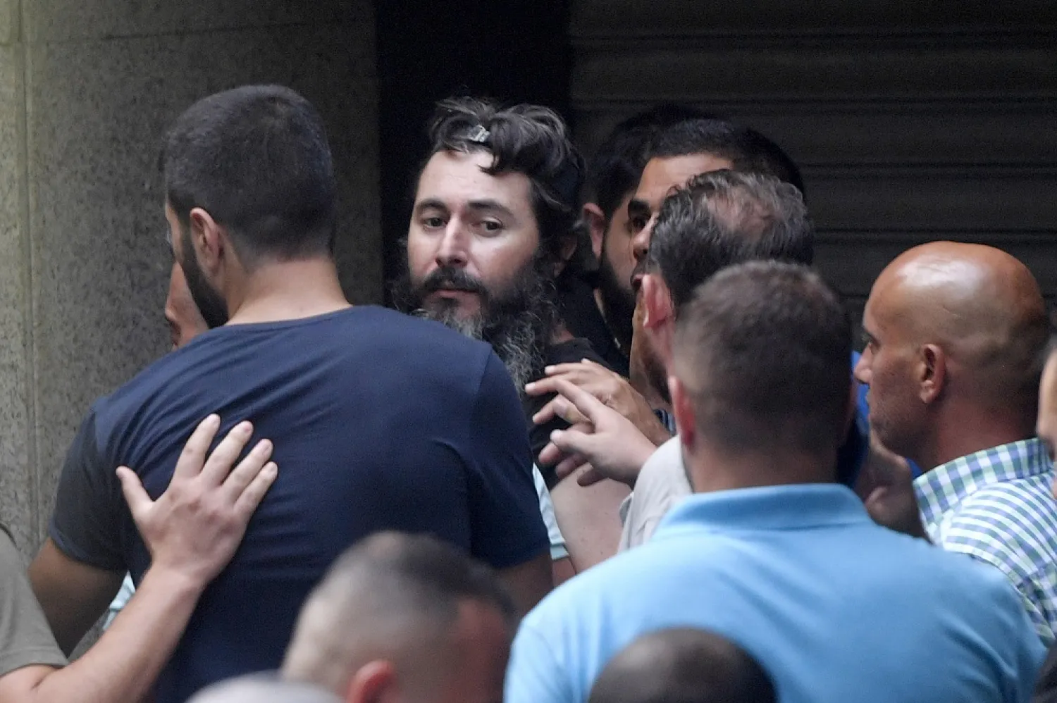 Bassam al-Sheikh Hussein, an armed man who took hostages, leaves the branch of a Federal bank in Beirut, Lebanon, 11 August 2022. (EPA)