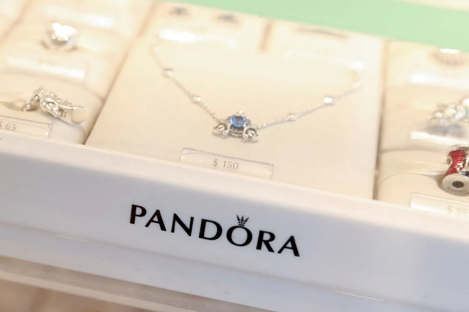 Pandora products are seen at their store at the Woodbury Common Premium Outlets in Central Valley, New York, US, February 15, 2022. (Reuters)