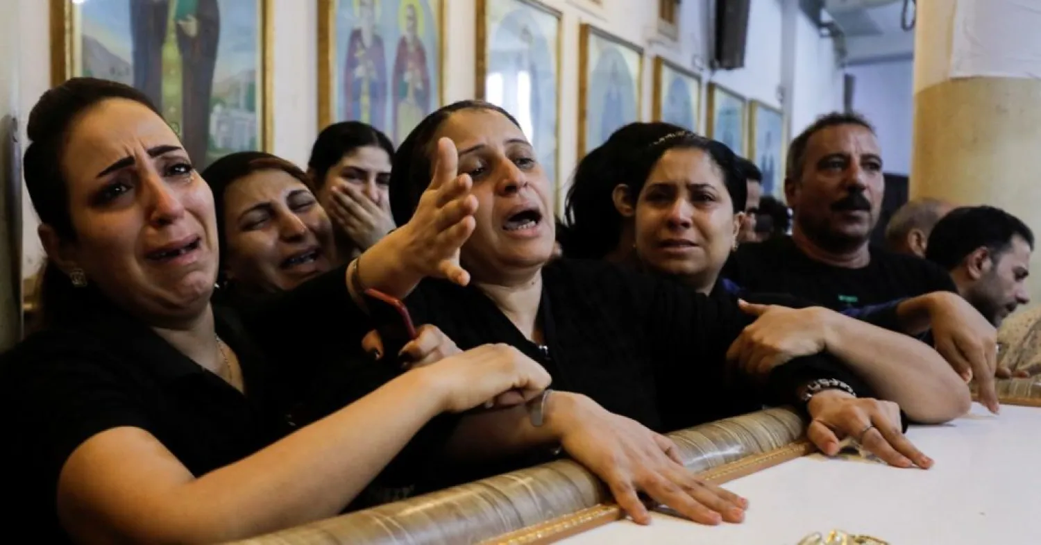 People react during the funeral of victims, who died due to the fire that broke out at the Abu Sifin church, inside the Church of the Blessed Virgin Mary at Warraq Al Arab district in Giza Governorate, Egypt, August 14, 2022. REUTERS/Mohamed Abd El Ghany