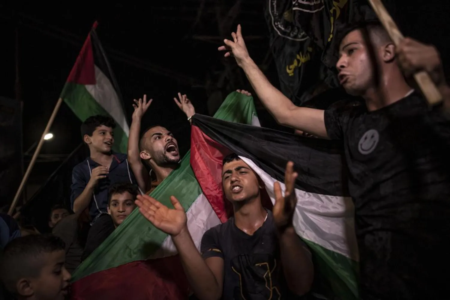 FILE: Palestinians celebrate the cease-fire agreement between Israel and Islamic Jihad Movement in Gaza City, early Monday, Aug. 8, 2022. . (AP Photo/Fatima Shbair)
