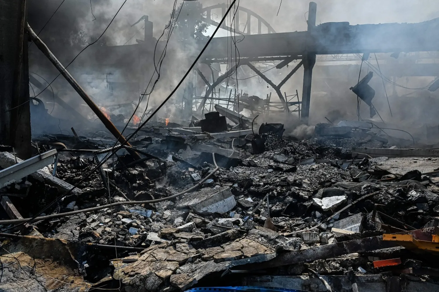 This photograph taken on August 19, 2022 shows a burning building of a chemical factory destroyed following a missile strike in the second largest Ukrainian city of Kharkiv, amid Russian's invasion of Ukraine. (AFP)
