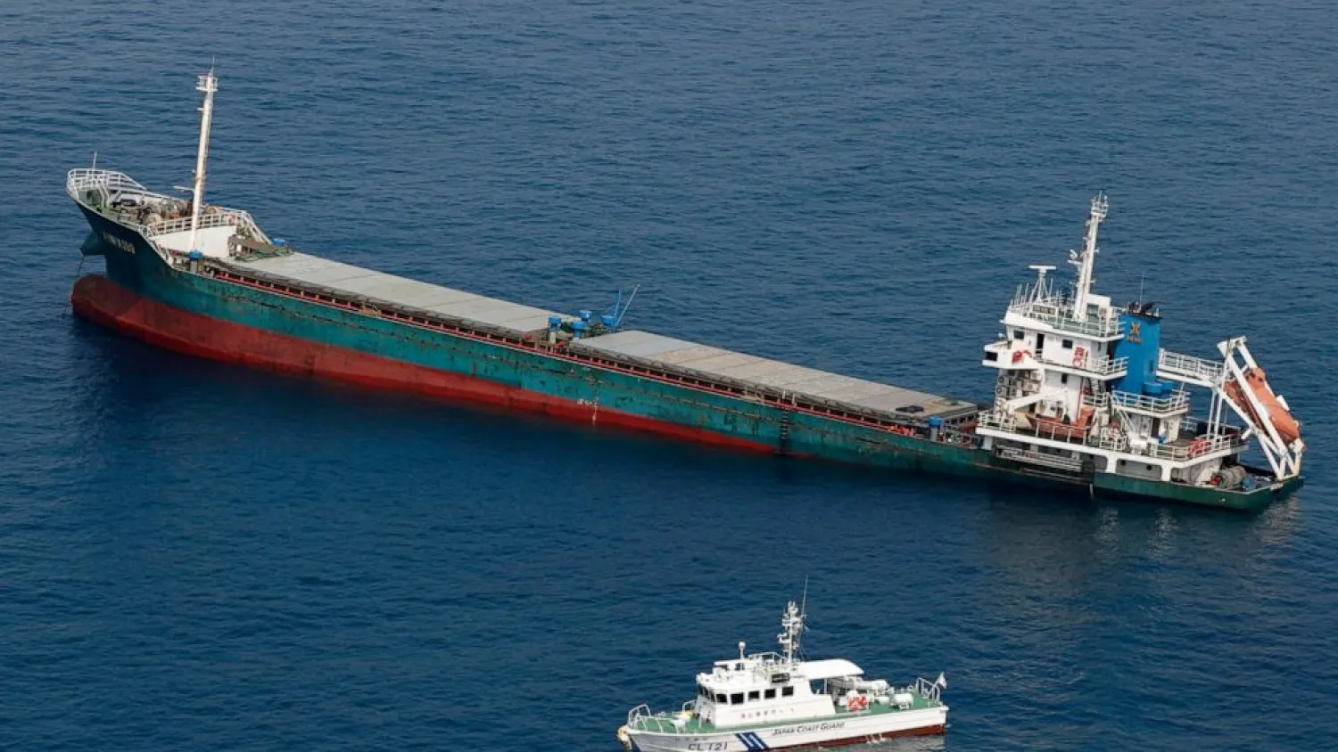 This aerial photo shows Belize-registered cargo ship Xin Hai 99, after a collision, off Kushimoto, Wakayama prefecture, southwestern Japan, Saturday, Aug. 20, 2022. (Kyodo News via AP)
