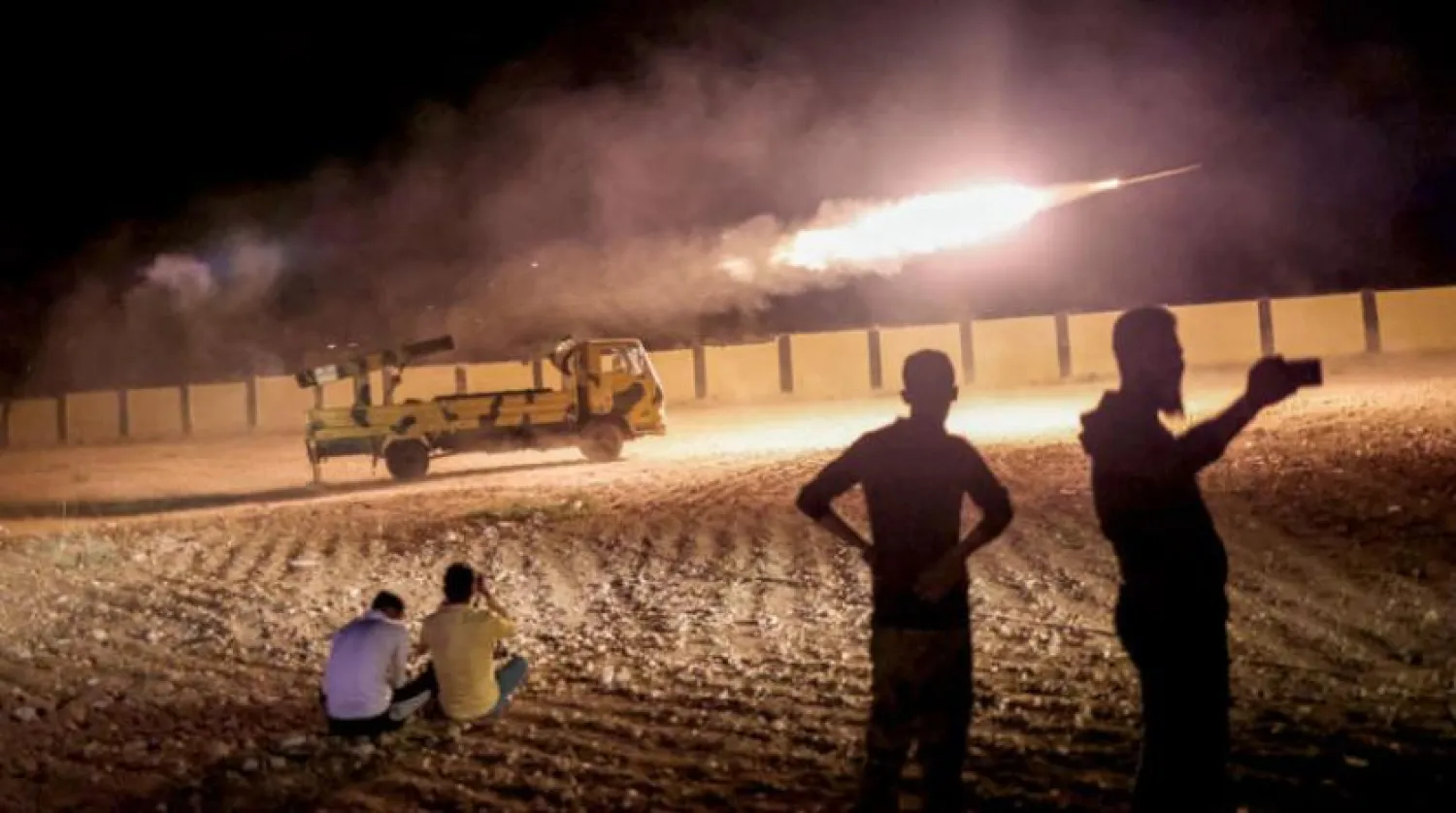 Members of the Türkiye-backed Syrian National Army fire missiles toward the positions of the Syrian regime forces in response to the al-Bab massacre (dpa)