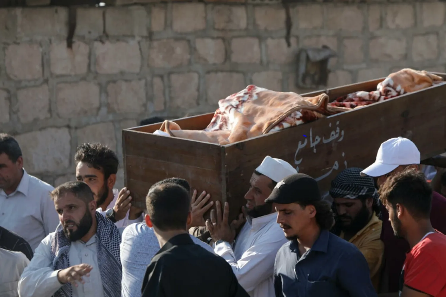 Mourners attend a funeral for people killed in reported artillery fire by Syrian government forces in the opposition-held city of Al-Bab on the border with Turkey Bakr ALKASEM AFP
