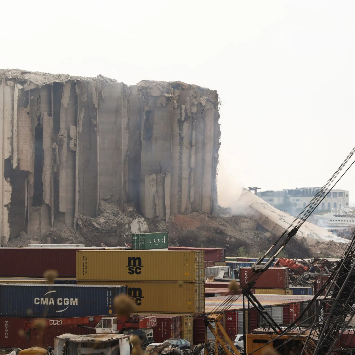 Smoke rises as part of the Beirut grain silos damaged in the August 2020 explosion collapse in Beirut Lebanon on August 4, 2022. REUTERS/Mohamed Azakir



