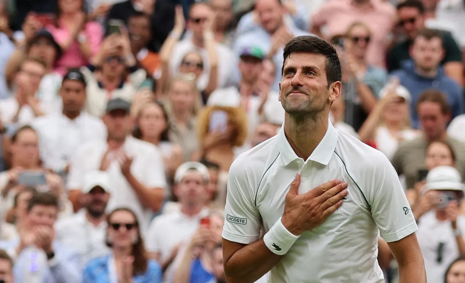 In this file photo taken on June 27, 2022, Serbia's Novak Djokovic celebrates beating South Korea's Kwon Soon-woo after their men's singles tennis match on the first day of the 2022 Wimbledon Championships at The All England Tennis Club in Wimbledon, southwest London. (AFP)