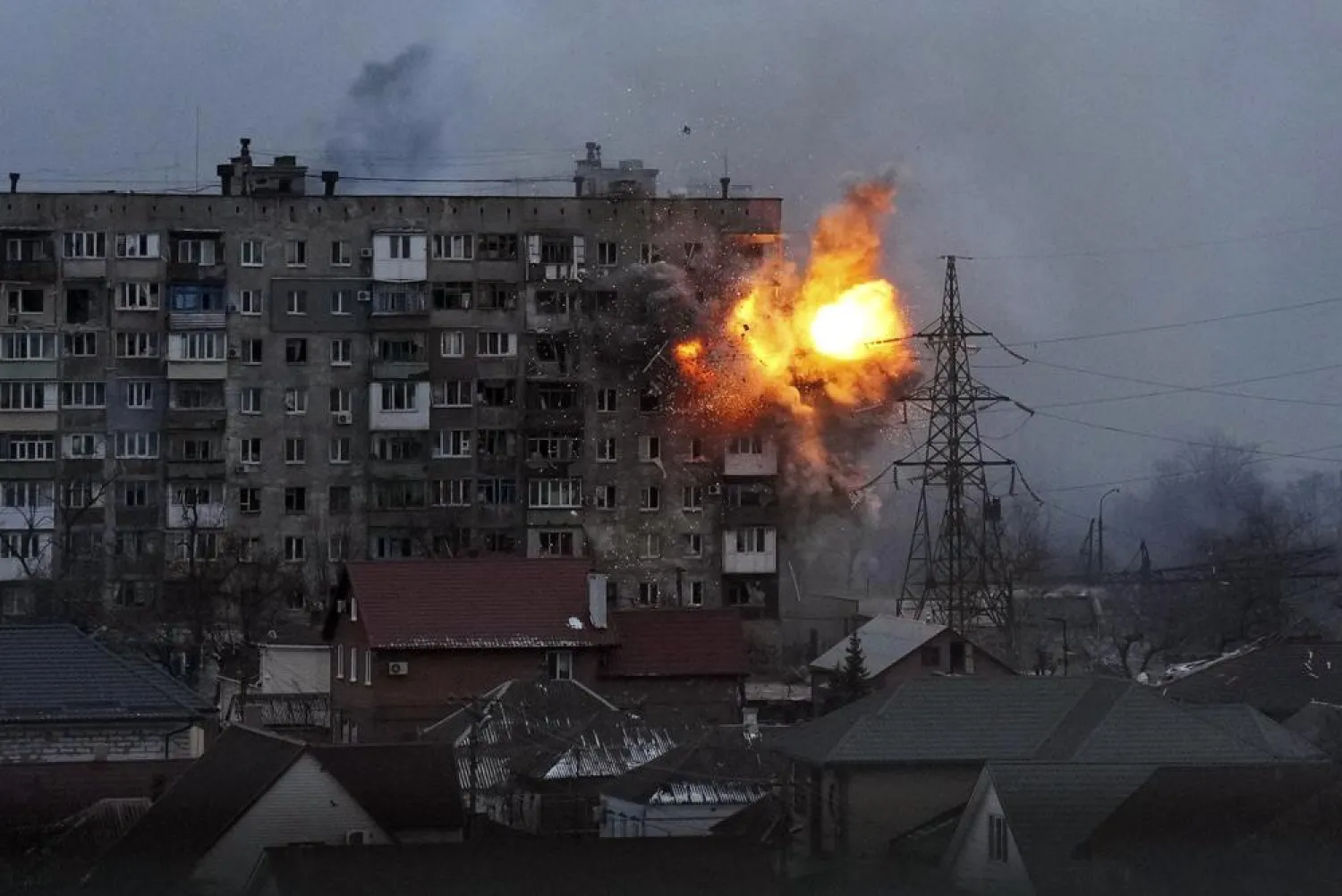An explosion is seen in an apartment building after Russian's army tank fires in Mariupol, Ukraine, March 11, 2022. (AP)