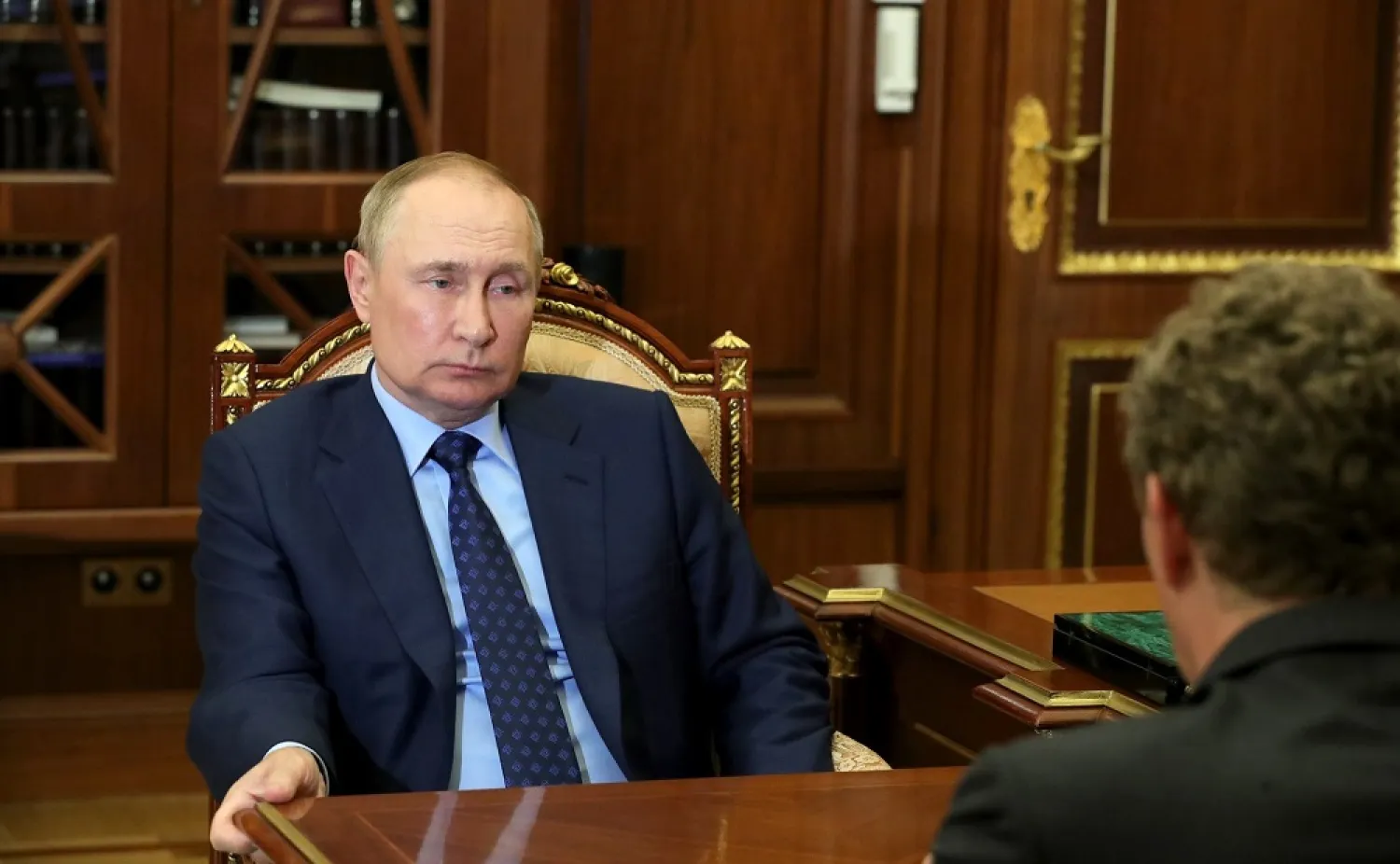 25 August 2022, Russia, Moscow: Russian President Vladimir Putin (L) holds a meeting with Daniil Yegorov, Director of the Federal Taxation Service. (Kremlin/dpa)
