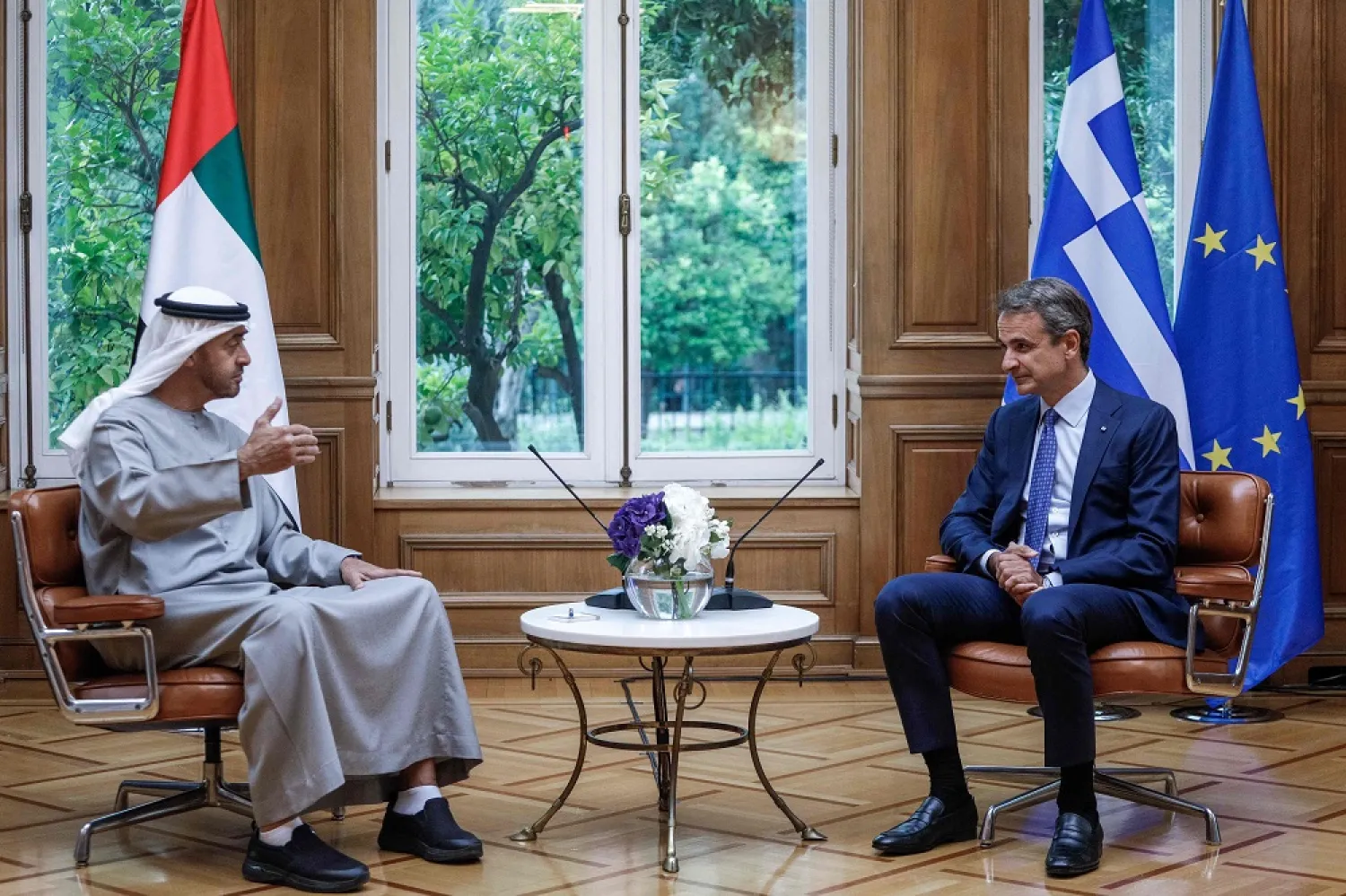Greek Prime Minister Kyriakos Mitsotakis (R) speaks with United Arab Emirates President Sheikh Mohamed bin Zayed al-Nahyan during their meeting in Athens on August 25, 2022. (AFP)